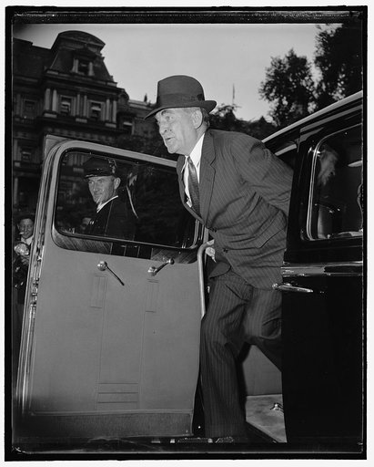 William Bankhead exiting automobile outside State, War & Navy building