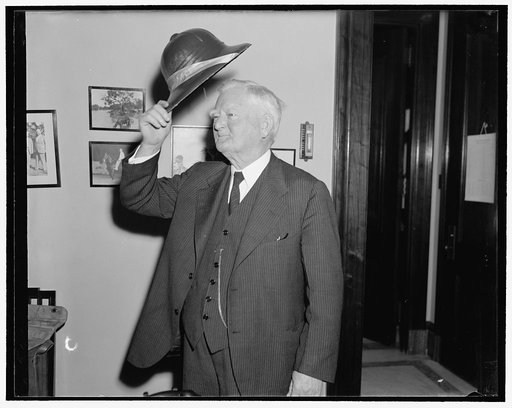 Another skimmer for vice president. Washington, D.C., Nov. 2. Vice President John N. Garner doffs his latest skimmer. This time it is a pitch helmet made of rice and was presented to the V.P. by officials of the National Rice Festival to be held at Crowley, La., November 7, 1939