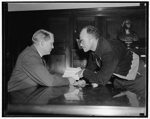 Dies and star witness. Washington, D.C., Nov. 2. Rep. Martin Dies, left, Chairman of the House Committee Investigating Un-American Activities, in a huddle with William C. McCuistion, his Dies star witness, who was recently arrested for New Orleans authorities on a murder charge. Dies has announced t