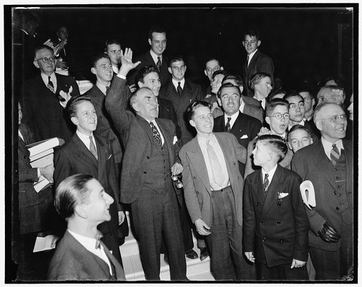 House adjourns after passing revised neutrality bill. Washington, D.C., Nov. 3. Surrounded by page boys, Speaker of the House William B. Bankhead waves goodbye to House members as the House adjourned sine die after passing administration's Neutrality Bill repealing the arms embargo