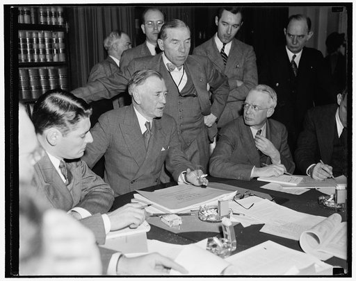 House and Senate conferees agree on final draft of neutrality bill. Washington, D.C., Nov. 3. Chairman of the Senate Foreign Relations Committee, Key Rittman, sitting, and Rep. Sol Bloom, standing Chairman of the House Foreign Relations Committee, as they outlined to reporters the final draft of the
