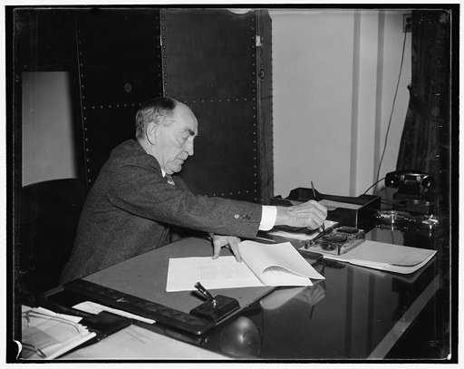 Speaker Bankhead dips pen to sign neutrality bill. Washington, D.C., Nov. 11. Speaker Bankhead got up bright and early this morning to sign the bill which was a victory for the administration. Vice President Garner signed the bill last night, and here is William Bankhead dipping the pen to sign hims