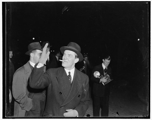 Finland Minister arrives for Soviet reception. Washington, D.C., Nov. 7. Finland's Minister Hjalmar J. Procope, was in a gay mood as he waved to photographers on his arrival at the Soviet Embassy today for the reception in celebration of 22nd anniversary of the Great October Socialist Revolution