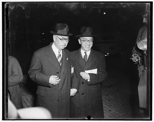 China well represented at Soviet Embassy. Washington, D.C., Nov. 7. Arm-in-arm Dr. Hu Shih, right, Chinese Ambassador to the United States, arrives for the reception at the Soviet Embassy with Dr. W.W. Yen. The reception was given to celebrate the 22nd anniversary of the Great October Socialist Revo