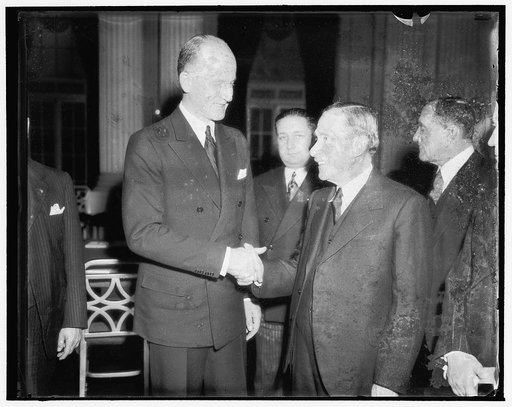 Welles named Chairman of the Pan American Committee to study war economic problems. Washington, D.C., Nov. 15. Undersecretary of State Sumner Welles, shown here talking to Dr. Esteban Jaramillo, delegate from Columbia, who was made Vice Chairman, today was unanimously elected Chairman of the Inter-A