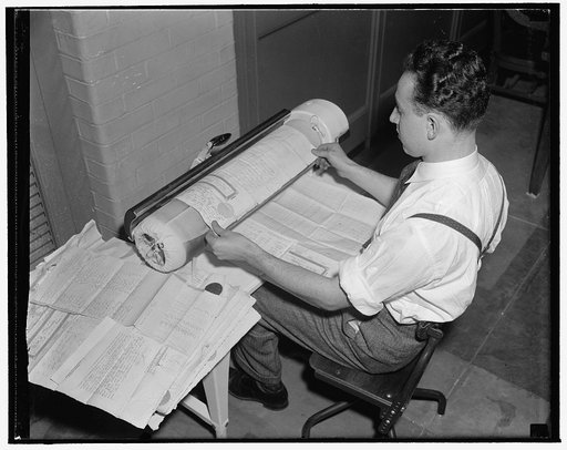 National Archives. Washington, D.C., Nov. 22. After leaving the humidifying chamber, the documents are brought to the special ironers to take all remaining wrinkles out