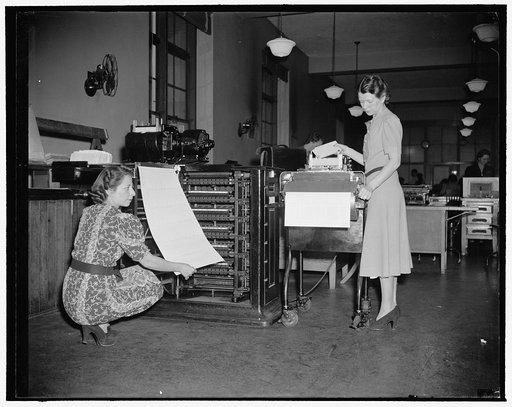 New machine to speed up statistics of census of 1940. Washington, D.C., Dec. 2. Back in 1870, it took 7 years to compile statistics from the facts taken by census takers, but in the next 10 years, Herman Hollerith invented a 'unit tabulator,' shown on left of photo being operated by Operator Ann Oli