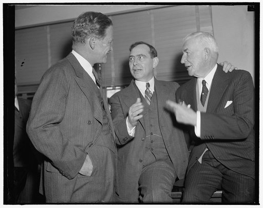 In spotlight at Republican meeting. Washington, D.C., Dec. 7. Early arrivals for today's meeting of the Executive Committee of the Republican National Committee were, left to right: John Hamilton, Chairman; Rep. Joseph W. Martin, Jr., House Republican Leader; and Henry P. Fletcher, General Counsel