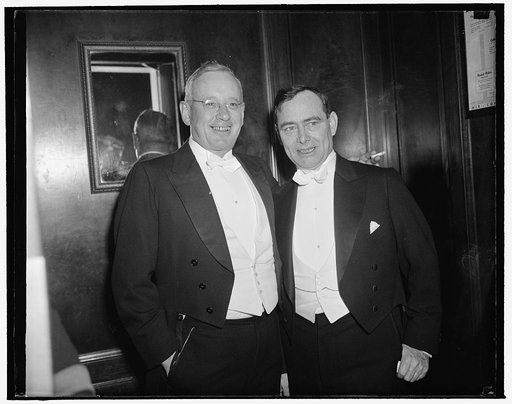 Annual Gridiron dinner. Washington, D.C., Dec. 9. Alfred Landon, former nominee for President, left, and Rep. Joseph Martin, right, seen together in the elevator on their way to the annual dinner honoring the president