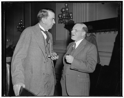NLRB member and Chairman of House NLRB Investigating Committee. Washington, D.C., Dec. 11. Before taking the stand as the first witness before the House NLRB Investigating Committee today, William M. Leiserson, right, member of the National Labor Relations Board, talked 'off-the-record with Rep. How