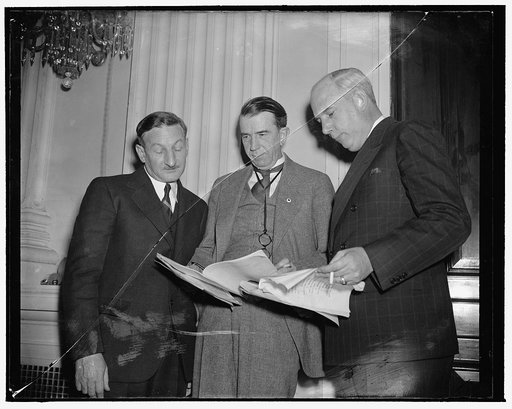 Principals in today's NLRB Committee hearing. Washington, D.C., Dec. 12. While Edmund Toland, Counsel for the Smith Committee Investigating the NLRB, was questioning William M. Leiserson, Board member, concerning the National Labor Relations Board, Charles Fahy, Counsel for the Board engaged in a ti