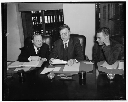 National Labor Relations Board. Washington, D.C., Dec. 22. This is a new picture of the National Labor Relations Board now under fire by a House Invetsigating Committee, left to right: William M. Leiserson, J. Warren Madden, Chairman, and Edwin S. Smith