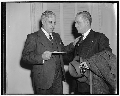 Mexican Ambassador presents check for $500,000 to State Department. Washington, D.C., Dec. 30. Mexico today made its sixth annual payment of $500,000 to the United States in payment for American claims made to the Mexican Government for mixed claims. He is shown here talking to Capt. Colon Eloy Alfa