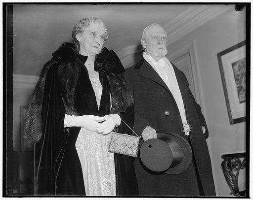 Chief Justice and Mrs. Charles Evans Hughes attend Judiciary reception at White House. Washington, D.C., Jan. 4. Chief Justice of the U.S. Supreme Court and Mrs. Charles Evans Hughes leaving their home tonight to attend the Judiciary reception at the White House