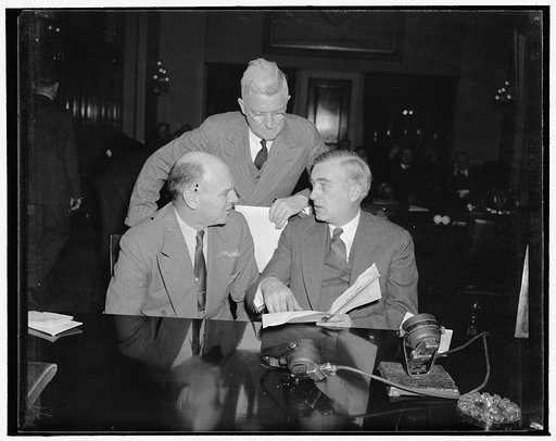 Naval leaders ask Congress for more armament. Washington, D.C., Jan. 8. Photographed today at the initial meeting of the House Naval Affairs Committee are, left to right: Lewis Compton, Assistant to Secretary of the Navy Charles Edison, Secretary Edison, with Admiral Harold R. Stark, Chief of Naval 