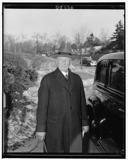 Associate Justice James Clark McReynolds of U.S. Supreme Court celebrating 78th birthday. Pictured leaving his apt. for usual daily walk, Feb. 1940