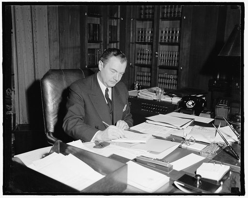 Atty. General Robert H. Jackson, at his desk as he celebrates his 48th birthday, Feb. 1940