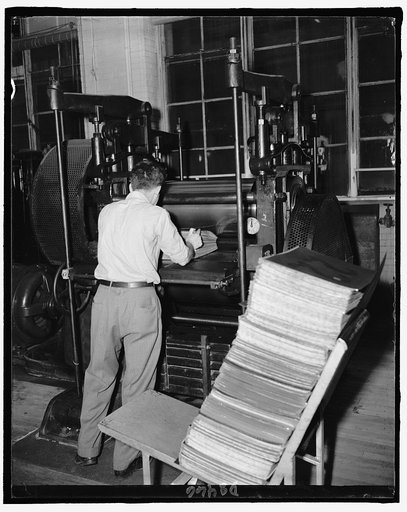 Bureau of Engraving. After being sized, the sheets are sent to another room where that are pressed by hydraulic means, counted and sent to be trimmed, Feb. 1940