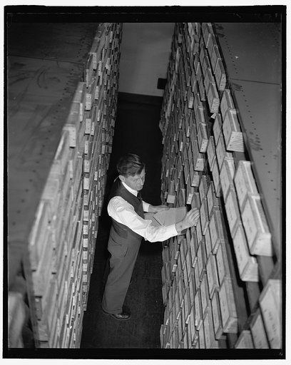 Man filing cards[?] at the US Census Bureau