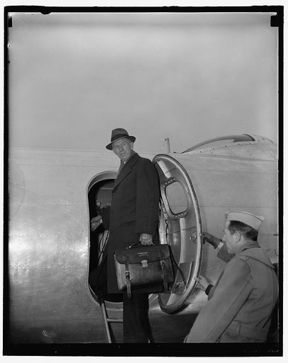 Gen. George C. Marshall boards a B-17B Flying Fortress in civilian attire