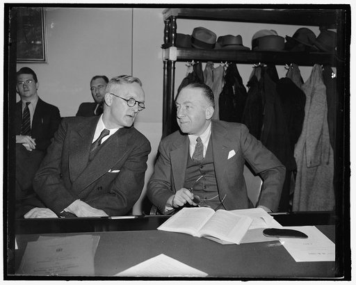 Governor urges increased appropriation for Alaskan roads. Washington, D.C., March 5. Shown here with Anthony J. Dimond, delegate from Alaska to Congress, Governor Ernest Gruening, right, today urged the House Roads Committee to increase to "at least $600,000" a proposed allocation of $400,000 for co