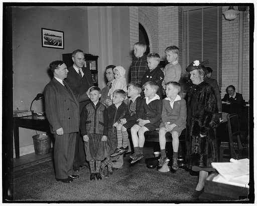 29 years of age, mother of 14 intoduces 9 of family to Republican minority leader. Washington, D.C., March 6. 29 years old and the mother of 14, Mrs. Dan Saphore with her husband, both of Churchtown, Pa., brought 9 of their brood to the Capitol today for a sightseeing tour. They are shown being intr