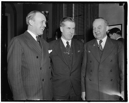 Henry A. Wallace (center)