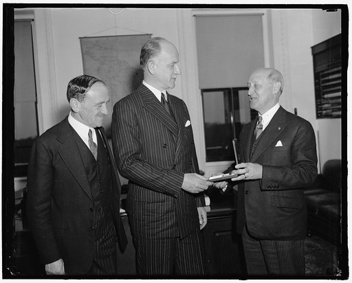 Sumner Welles (center)