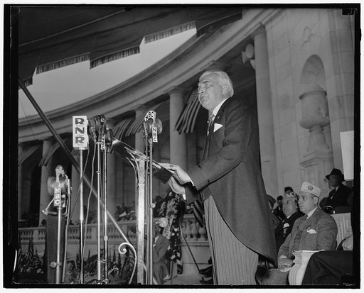 McNutt delivers principal address at Memorial Day ceremonies at Arlington National Cemetery. Washington, D.C., May 30. Paul McNutt, Federal Security Administrator, delivering the principal address at the Memorial Day ceremonies at Arlington National Cemetery today