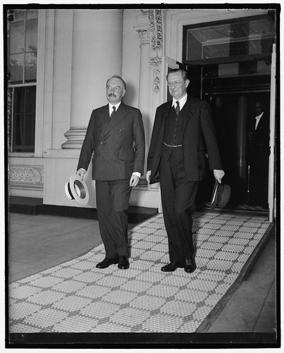 French and British Ambassadors confer with President Roosevelt. Washington, D.C., June 15. The French and British ambassadors, Count Rene De Saint-Quentin, left, and Lord Lothian, respectively, leaving the White House today following a conference of more than an hour. The meeting 'cleared up some th