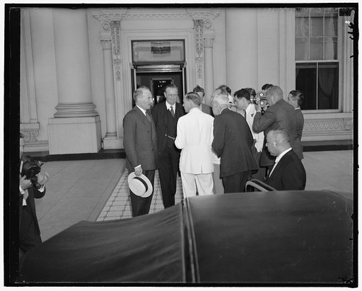 Reporters quiz French and British ambassadors following their conference with president. Washington, D.C., June 15. Reporters and cameramen surround the French Ambassador Count Rene De Saint-Quentin, left, and British Ambassador Lord Lothian as they left the White House today following a requested c