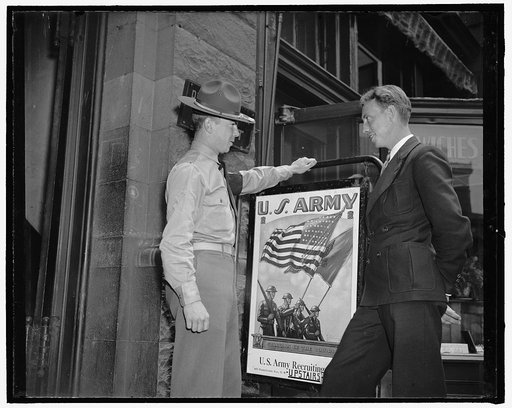 New recruits join up, Washington, D.C. Private First Class Sherwood M. Frye talking to William Lambert, 23 years old of Franklyn, W. Virginia, about enlisting