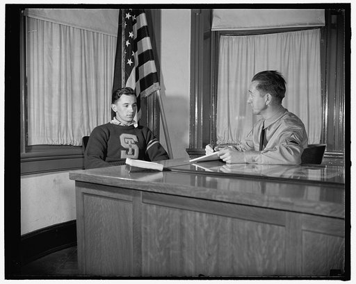 New recruits join up, Washington, D.C. Louis Benne, 19 years old, of Friedens, PA., being interviewed by Sergeant Norman W. Morgan, at desk