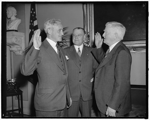 New Republican Senator from Vermont takes oath. Washington, D.C., July 1. Senator Ernest W. Gibson, Jr., was today sworn in as a Republican member of the upper house of Congress to fill the unexpired term of his father the late Senator Ernest W. Gibson. Left to right: Senator Ernest W. Gibson, Jr., 