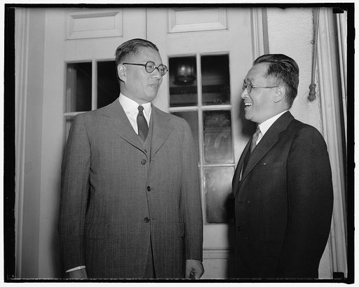 Governor of Bank of China presented to President Roosevelt. Washington, D.C., July 1. Dr. T.V. Soong, left, Governor of the Bank of China, was presented to President Roosevelt today by Dr. Hu Shih, Chinese ambassador. Dr. Soong told reporters his visit was purely social, 7-1-40