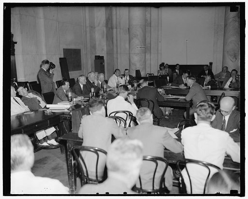Col. Knox appears before Senate Naval Affairs Committee. Washington, D.C., July 2. A general view of the Senate Naval Affairs Committee room as Col. Frank Knox testified today regarding his qualifications to be secretary of the Navy. Knock can bee seen on the right facing the Committee, 7-2-40
