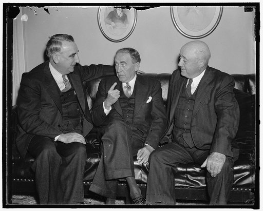 "Congressional Chief get together." Washington, D.C., Nov. 13. House leaders get together before the opening of Congress Monday, left to right Rep. Fred Vinson, Ky. chairman of the House Ways and Means Subcommittee on Taxation, Speaker William Bankhead, Majority Leader Sam Rayburn, of Tex., 11/13/37