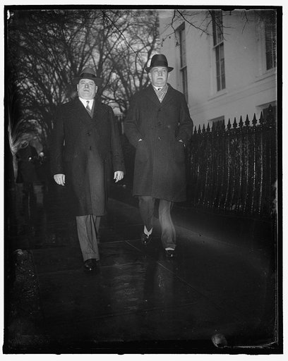 Auto heads confer with Roosevelt. Washington, D.C., Jan 21. K.T. Keller, president of Chrysler, left; and William S. Knudsen, president of General Motors, shown leaving the White House today, after they approved President Roosevelt's credit selling recommendations, 1/21/38