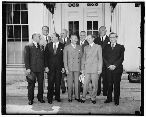 Movie Industry pledges cooperation with the government. Washington, D.C., June 25. At a conference with President Roosevelt today, a group of motion picture company executives, led by Will Hays, emphasized the desire of the industry to cooperate with the government. In the front row, left to right: 