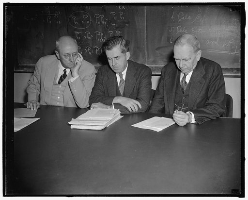 First formal meeting of the Commodity Exchange Commission. Washington, D.C., May 26. The Commodity Exchange Commission, photographed for the first time today while hearing a complaint of the Cargill, Inc. against the Chicago Board of Trade, the board consists of the Attorney Gen. Homer Cummings, lef