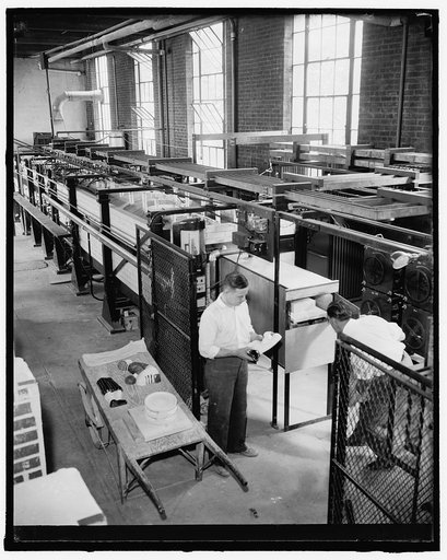 New method of making pottery. Washington, D.C., June 17. Receiving end of the new electrically heated 45 foot tunnel kiln at the National Bureau of Standards. This kiln makes it possible to fire pottery in as little as 16 hours compared with 2 and 3 days or more in the older types of kilns, picture 