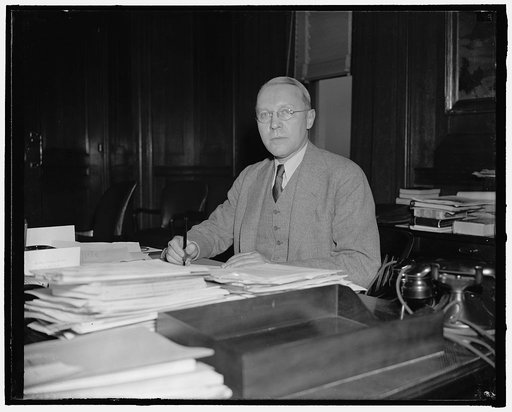 New Assistant Secretary of Interior. Washington, D.C., April 9. Ebert Burlew, new First Assistant Secretary of Interior, photographed at his desk shortly after taking the oath of office yesterday. He succeeds the late Theodore A. Walters, 4/9/38