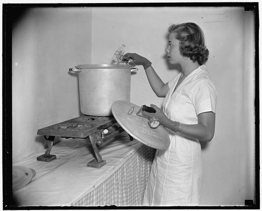 Miss Ann Turner sterilizing bottles