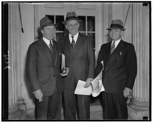 Leaving conference with Pres. Roosevelt. Left to right: Asst. Secy. of Treasury John W. Hanes, Secy. Morgenthau, & acting Budget Dir. Daniel Bell