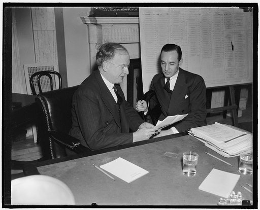 Young Ford blames ICC. Washington, D.C., Jan. 7. ICC order that all railroads use heavy equipment caused the Fords to sell the Detroit, Toledo, and Ironton Road in 1929, Edsel Ford, (right) President of the Ford Motor Co., told Chairman Burton K. Wheeler of the Senate rail inquiry today