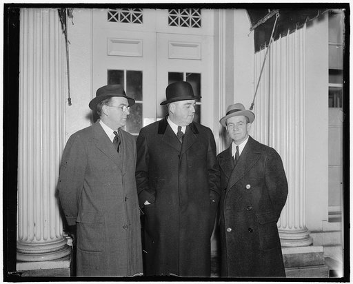 Massachusetts governor protests proposed trade pact with Great Britain. Washington, D.C., March 16. Governor Charles F. Hurley, (center) of Massachusetts, arriving at the White House where he left a protest with President Roosevelt against the proposed trade pact with Great Britain. Hurley said if t