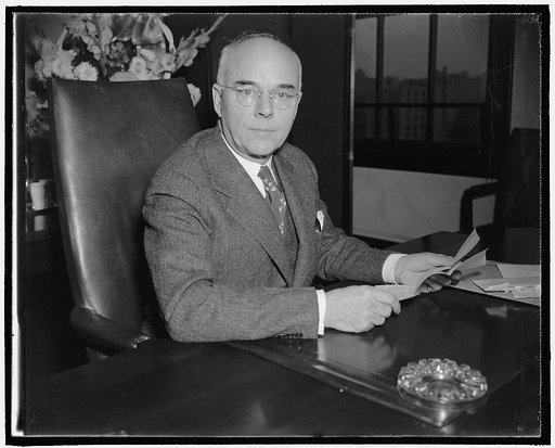 New S.E.C commissioner. Washington, D.C., Dec. 12. Recently appointed by President Roosevelt to be a member of the Securities and Exchanges Commission, Rep. Edward C. Eicher of Iowa, today took the oath and assumed his new duties immediately