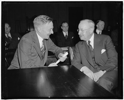 S.E.C. chairman talks with monopoly witness. Washington, D.C., Feb. 8. Chairman of S.E.C. William Douglas [...] Frederick Ecker, chairman of the board of Metropolitan Life Insurance Co. and today's witness before the [...]tional Economic Committee, chatting informally before the beginning of today's