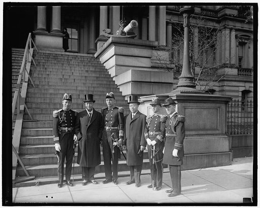 Chinese on world tour. Chinese Naval officers on world tour meet President Hoover. Photographed in front of the temporary White House executive offices, left to right, they are: Comdr. S.C. Whang, Mr. Hollington K. Tong, Admiral H.K. Tu, Minister C.C. Wu, Lt. Comdr. M.H. Ching, and Lt. Comdr. T. De 