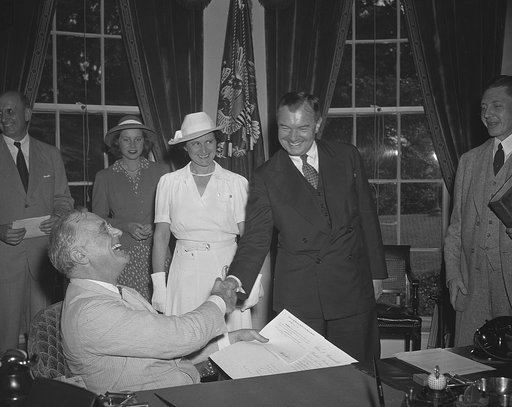 Robert Jackson sworn in as Justice. Washington, D.C. July 11. Robert Jackson was sworn in as Associate Justice of the Supreme Court in President Roosevelt's office before an audience comprising most of the high officials of the New Deal with whom he had been associated for seven years. Picture shows
